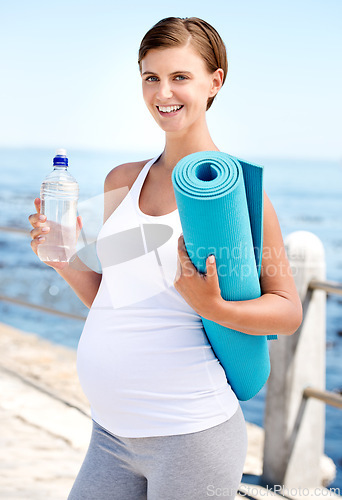 Image of Pregnant woman, water and yoga outdoor at beach with prenatal health, fitness in nature with h2o and ocean. Nutrition, pregnancy pilates and liquid for mom, hydration and exercise mat with wellness