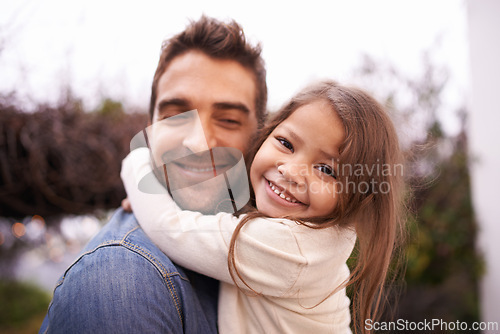 Image of Hug, love and father carry girl for bonding, outside and family for quality time. Portrait, parent and young daughter with smile in nature, embrace and happiness for vacation or travel with dad