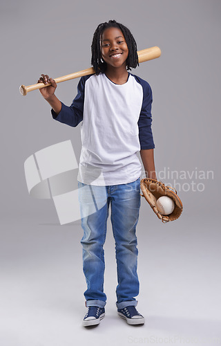 Image of Baseball, portrait and black child in a studio with smile, sport and fitness gear with game of kid. Youth, happy and African boy with modern, casual and hipster fashion with glove and grey background