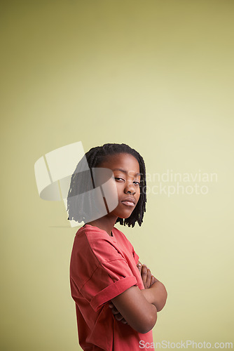 Image of Portrait, thinking and boy child with arms crossed in studio for solution, confidence or wondering on green background. Doubt, face and African teen model with gesture for suspicious body language