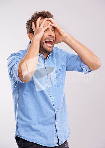 Image of Stress, screaming or man with hands on face in studio for mental health, crisis or mistake on white background. Anxiety, overthinking or male model with bad reaction to news, disaster or broken heart