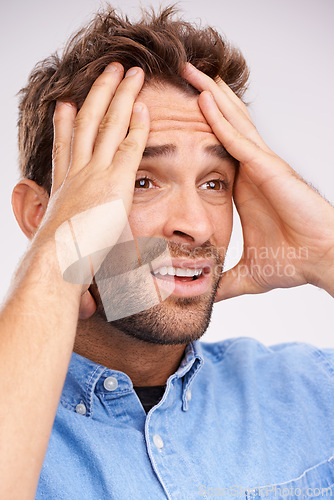 Image of Stress, fear or sad man with hands on face in studio frustrated by fail, accident or mistake on white background. Anxiety, depression or guy model overthinking trauma, conflict or overwhelmed by loss