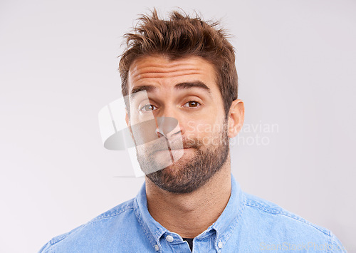 Image of Studio, portrait and bored man with doubt, frustrated and confused on white background. Opinion, disappointment and face of person with decision, conflict or uncertainty for choice, news or ideas