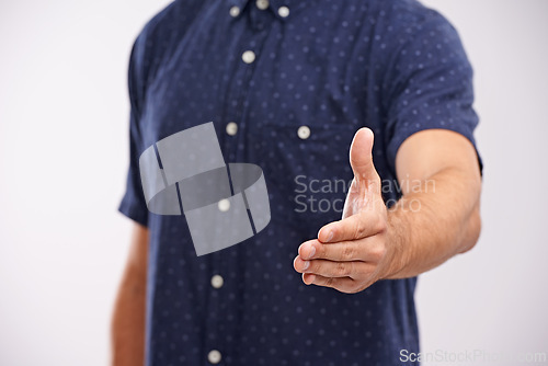 Image of Handshake, closeup and welcome person in studio, background and introduction in mockup space. Hand, gesture and networking for business with confidence and say thank you for agreement or offer