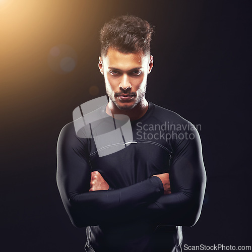 Image of Fitness, portrait and man in studio with confidence, serious and workout for health, wellness and power. Arms crossed, pride and strong athlete on black background for exercise, results and care