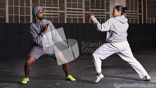 Image of Martial arts, fight and man with woman, fitness and wellness with cardio or exercise with energy. Challenge, coach or athlete with sports or workout with competition or fighter with skill or training