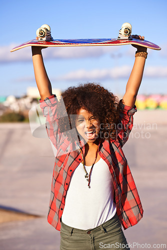 Image of Portrait, fashion and excited black woman with skateboard in city for exercise, training and skating in skatepark. Skater, shouting and face of female person for trendy, edgy and hipster clothing