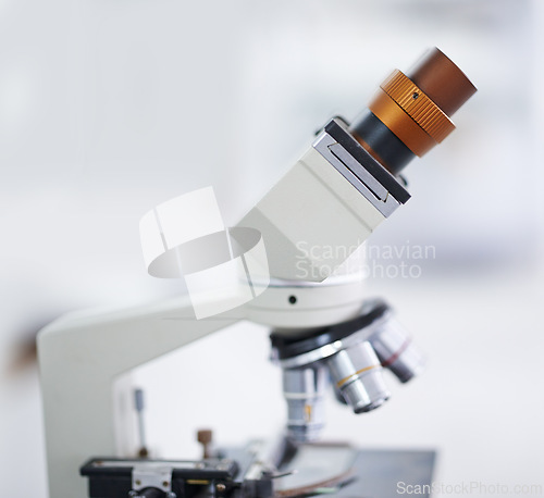 Image of Microscope, laboratory and equipment for microbiology, chemistry or research on biotechnology. Empty room or interior of medical or scientific tool for discovery, magnifying or microscopic organisms