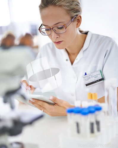 Image of Reading, research and woman with tablet in medical laboratory with development in biotechnology. Scientist, typing or check results online of pharmaceutical report or review of innovation in science