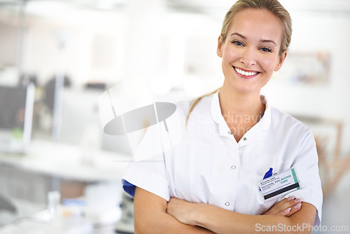 Image of Happy woman, portrait and professional with arms crossed at laboratory for healthcare or science. Face of young female person or medical researcher in confidence for PHD or career ambition at the lab