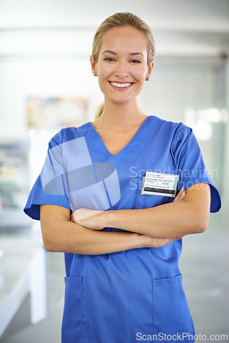 Image of Happy woman, portrait and professional nurse with career ambition or confidence for healthcare or science at hospital. Young female person or medical doctor with smile and arms crossed for PHD at lab