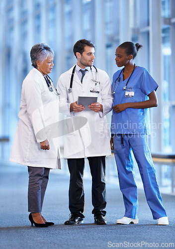 Image of Doctors, expert and team in hospital with tablet for online, discussion and health for nurse and treatment. Diverse, people or group with tech for healthcare, medical and medicine with stethoscope