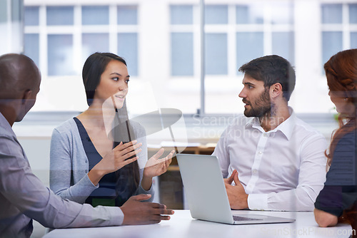 Image of Business people, meeting and boardroom teamwork at tech startup for brainstorming, project planning or collaboration. Men, women and conversation with laptop for b2b partnership, decision or report