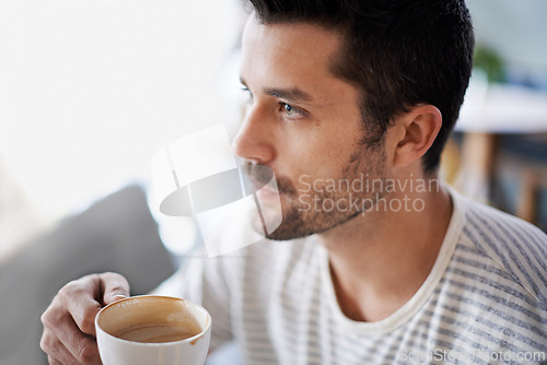 Image of Coffee, thinking and man with drink in restaurant, cafeteria and diner for breakfast, wellness and break. Person with idea, thoughtful and wondering with beverage, caffeine and cappuccino in morning