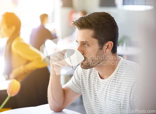 Image of Coffee, thinking and man drinking in restaurant, cafeteria and diner for breakfast, wellness and break. Person with idea, thoughtful and wondering with beverage, caffeine and cappuccino in morning