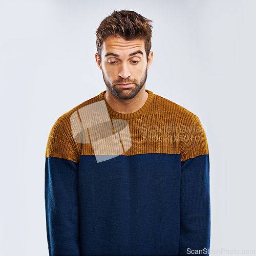 Image of Frustrated man, bored and down with stress, depression or anxiety on a studio background. Young, tired or upset male person or model with mood, disappointed or mental health breakdown on mockup space