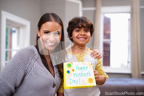 Image of Child, mom and portrait with card for mothers day, surprise and appreciation for love and kindness. Indian people, parent and boy with smile and joy with gift for giving, celebrating and childhood