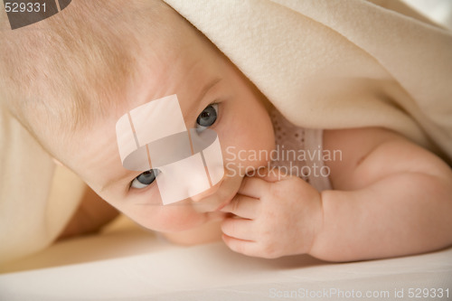 Image of baby in a bed 