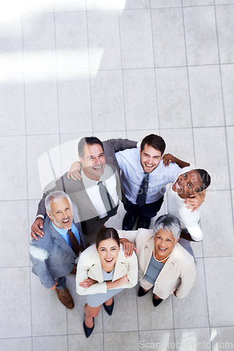 Image of Business people, portrait and huddle for team hug in office, community and support or unity. Colleagues, diversity and collaboration in embrace in workplace, solidarity and above for cooperation