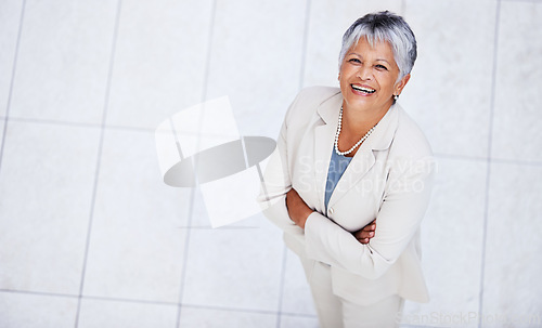 Image of Business, portrait and high angle of woman with arms crossed in office with professional confidence and pride. Above, entrepreneur and happy mature person in lobby excited for morning at workplace