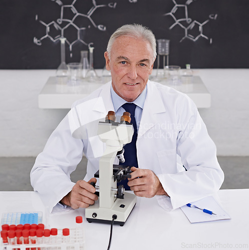 Image of Scientist, man and portrait with microscope in lab for vaccine study, development or dna test. Mature doctor, smile and biotechnology for bacteria sample, medical research or growth in chemistry