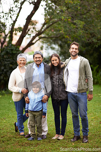 Image of Family, smile and portrait in garden or backyard for relationship, grandparents and child with mom and dad for joy. Group, senior people and kid for bonding, love and happiness together in park