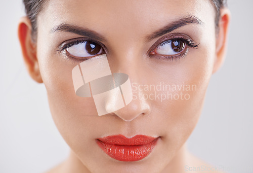 Image of Woman, beauty and thinking in studio of makeup, dermatology and skin care on a white background. Closeup and face of a young model or person with facial foundation and inspiration or cosmetics ideas