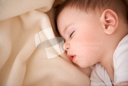 Image of Baby, sleeping and tired in a home relax with nap in nursery with peace in a bed with blanket. Morning, youth and kid with dream of an infant with child development from rest in bedroom with newborn