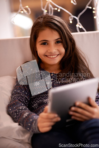 Image of Girl in portrait, kid and tablet, tech and communication with ebook for reading and social media at home. Elearning, movie or storytelling app with internet, browsing and digital platform for gaming