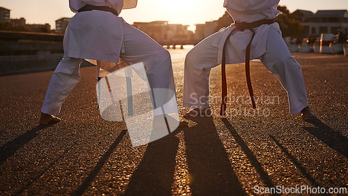 Image of People, karate and legs with martial arts in self defense, class or teaching in the city street. Outdoor fighter, athlete or sparring partner in fitness training, kata or technique in an urban town