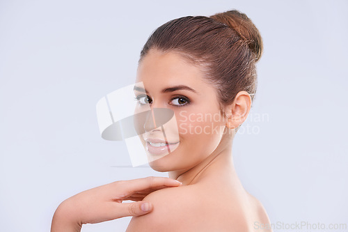 Image of Beauty, portrait and woman with skincare, smile and benefits of facial cosmetics in studio. Dermatology, face and happy girl with natural makeup, healthy glow and luxury skin care on white background