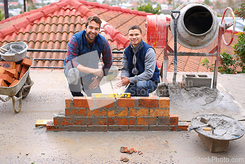 Image of Construction, bricklayer and men building a brick wall, handyman or contractor with trade, mentor and apprentice in industry. Team, builder and cement with tools, maintenance renovation for training