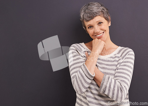 Image of Portrait, smile and elderly woman with retirement, happiness and casual outfit on a grey studio background. Face, pensioner and old person with mockup space and cheerful with trendy clothes or joyful