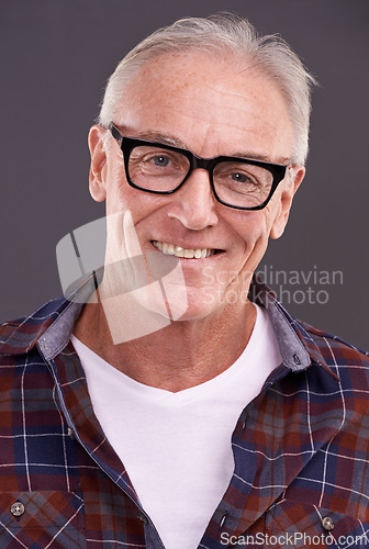 Image of Mature man, fashion and glasses with smile in studio on background for eyewear, optometry and satisfied. Portrait, happy and style or casual outfit with positivity for retirement and enjoy with laugh