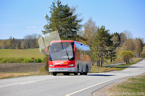Image of Red OnniBus FLEX Coach Bus on Road