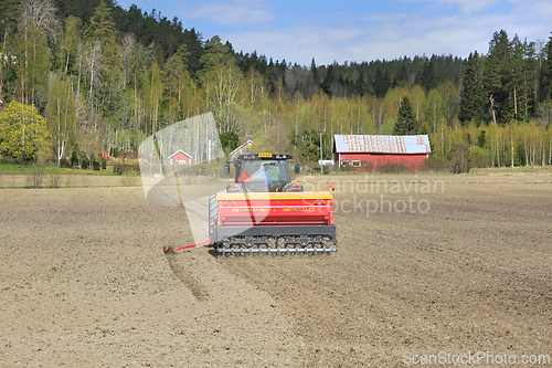 Image of Tractor and Seed Drill at Work