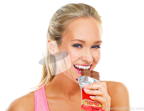 Image of White background, portrait and bite of chocolate by woman, smile and cheat day on diet for athlete. Adult, female person and girl with happy for dessert to enjoy after exercise or workout in studio