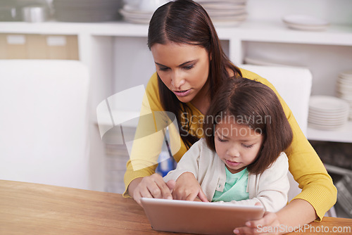 Image of Typing, home and mother with girl, tablet and bonding together with social media or connection. Online reading, family or mama with daughter or relax with tech or internet with digital app and movie