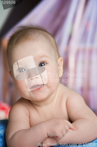 Image of baby in a bed 