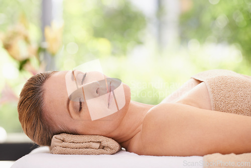 Image of Woman, face and peace at spa, massage and wellness with calm and self care for bodycare. Cosmetics, beauty and facial, relax with eyes closed at luxury resort and treatment for stress relief