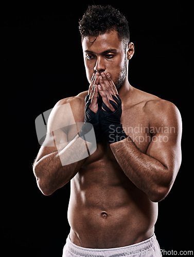 Image of Man, boxer and thinking in studio for sports, fitness and warrior training on black background. Person, athlete and strong muscles for workout or exercise, contemplating and battle or competition