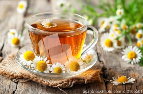 Image of A Cup of Chamomile Tea on a Wooden Table