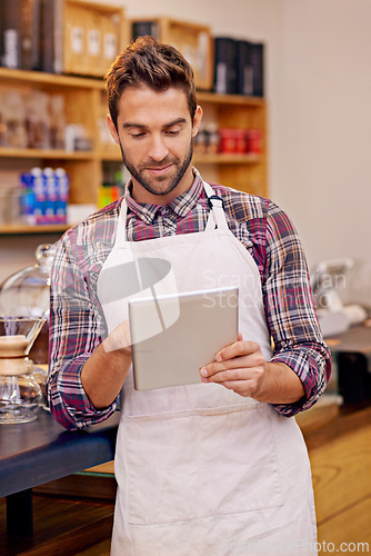 Image of Man, barista and tablet for reading in coffee shop with smile, thinking or communication for online order. Person, waiter and digital touchscreen for typing, click or check for ecommerce in cafeteria