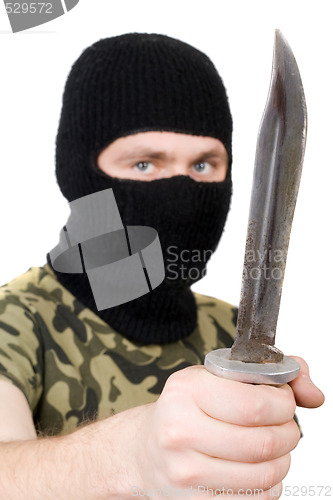 Image of Portrait of the killer with a knife. Focus on the knife