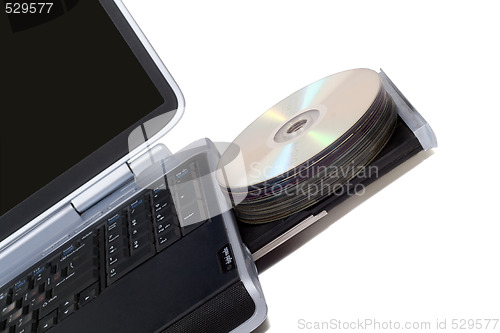 Image of Laptop with overloaded DVD Drive. Isolated on white