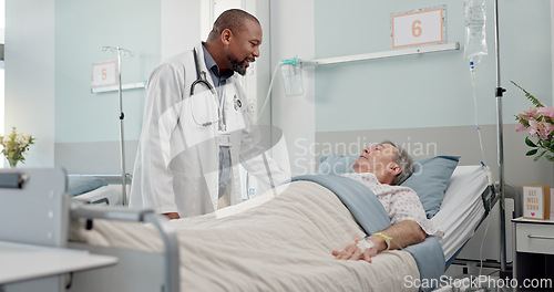 Image of Consultation, healthcare and doctor with patient in hospital after surgery, treatment or procedure. Discussion, checkup and African male medical worker talk to senior man in clinic bed for diagnosis.