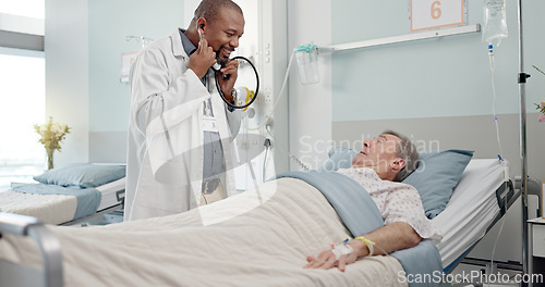 Image of Consultation, stethoscope and doctor with patient in hospital after surgery, treatment or procedure. Discussion, checkup and African male medical worker talk to senior man in clinic bed for diagnosis