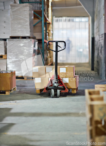 Image of Trolley, boxes and packages with shipment in supply chain, distribution or storage at warehouse. Empty factory or interior of equipment for parcel transportation, logistics or inventory at depot