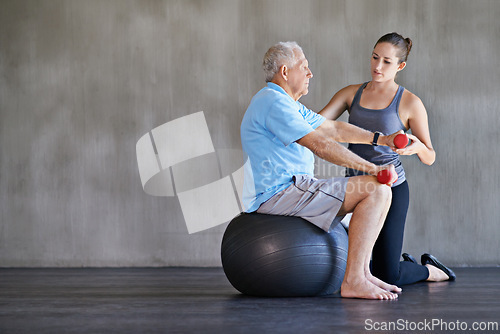 Image of Physical therapy, dumbbells and elderly man on ball for fitness, rehabilitation or exercise at gym on mockup. Senior person, weightlifting and personal trainer help for body health or physiotherapy