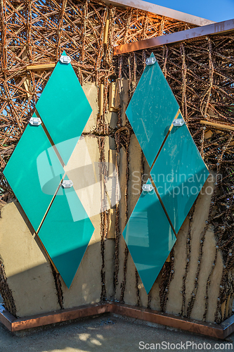 Image of Small solar panels for solar energy installed on a wall of public park pavillon, photovoltaic, alternative electricity source